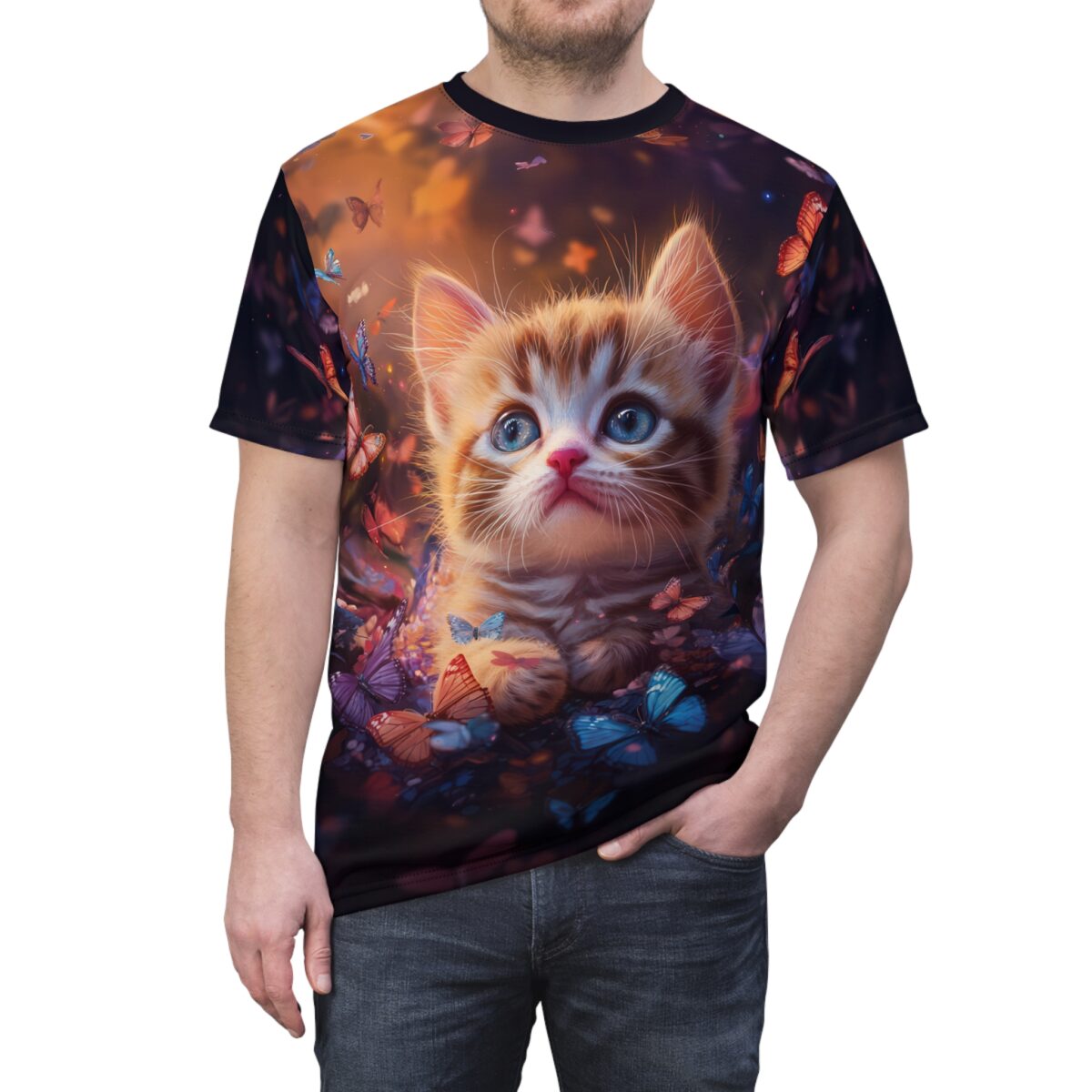 A t-shirt features a detailed print of an adorable orange tabby kitten with big blue eyes, nestled among colorful butterflies and flowers.