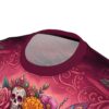 Rich pinks and reds adorn this sublimation graphic tee, featuring a sugar skull with floral crown and swirling ornate patterns.
