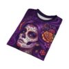 Vibrant purple hair and orange floral accents decorate this soft Catrina sugar skull sublimation print t-shirt for a vivid, spooky look.