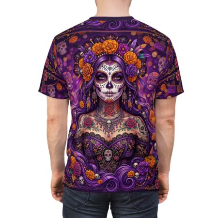 Vibrant purple La Catrina sugar skulls and marigolds showcase a 360-degree graphic that flows seamlessly across the entire surface of this t-shirt.