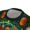 Vibrant marigolds and ornate sugar skulls adorn this soft polyester tee, which uses a 360-degree graphic to display rich green and orange motifs.
