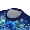 Vibrant blue sugar skulls and intricate floral motifs blanket this tee in a 360-degree graphic that wraps seamlessly from edge to edge.