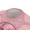 Soft pink all over print t-shirt with delicate floral and swirl patterns, and a sugar skull design.