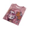 Pink calavera with floral accents and skull charms adorn this all over print t-shirt.