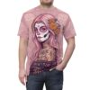 Pink background with floral sugar skull calavera graphic, this is an all over print t-shirt.
