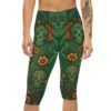 Intricate green sugar skull and orange floral patterns fill these capri leggings, with detailed scrollwork and leaf motifs throughout.