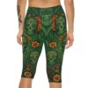 Green sugar skull and orange floral patterns cover this all over print apparel, with swirling vines and leaves in the background.