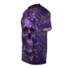 Ornate purple skull surrounded by deep violet and lavender floral blooms, ferns, and berries on this all over print t-shirt.