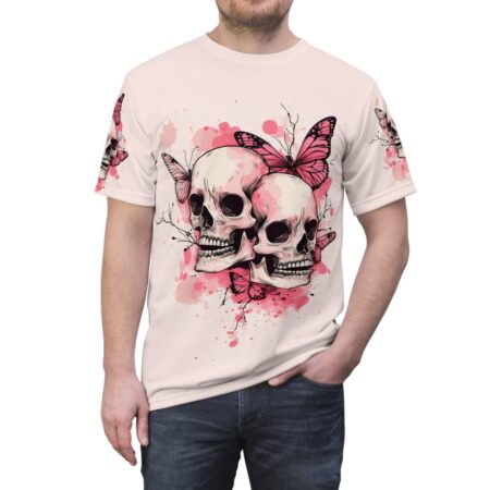 Pink and white watercolor splatters and delicate branches surround two detailed skulls, with vibrant pink butterflies fluttering around them on this seamless pattern tee.