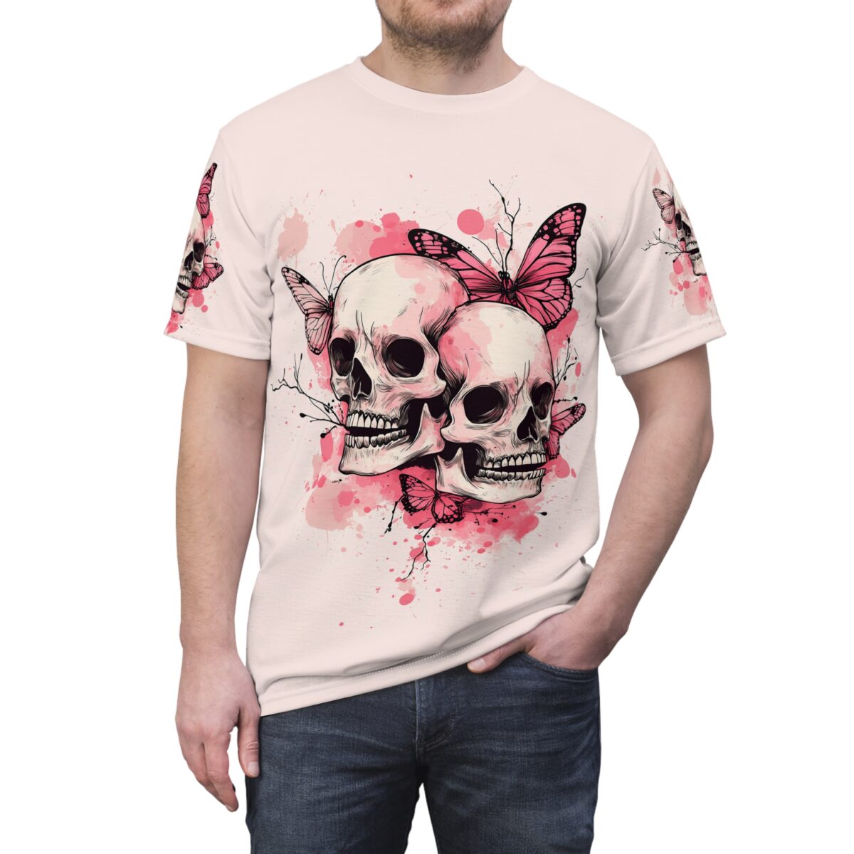 Pink and white watercolor splatters and delicate branches surround two detailed skulls, with vibrant pink butterflies fluttering around them on this seamless pattern tee.