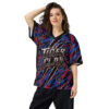 This jersey features a vibrant all over print design with red, blue, and black jagged stripes and tiger face graphics.