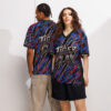 All over print sublimation tee showcases a dynamic tiger claw graphic in red, blue, and black with tiger head emblems.
