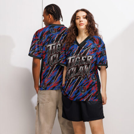 All over print sublimation tee showcases a dynamic tiger claw graphic in red, blue, and black with tiger head emblems.
