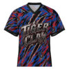 This sublimation tee features an all-over print design with abstract claw marks in red and blue, and repeating tiger head graphics. The 