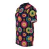 All over print colorful crochet circles sublimation tee features a dark background with vibrant, circular floral patterns and small leaf motifs.