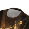 Close up shot of a crew neck t-shirt featuring a black and gold liquid paint splatter pattern.