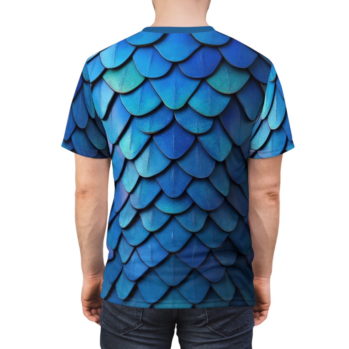 Back view of a person wearing a short sleeve t-shirt with a blue dragon scale pattern.