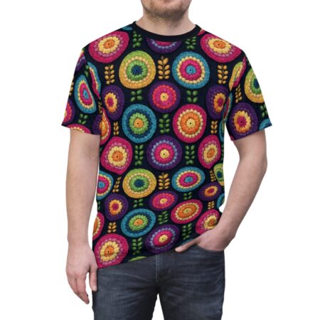 Men's sublimation tee with all over print of colorful crochet flowers and small leaf motifs on a dark background.