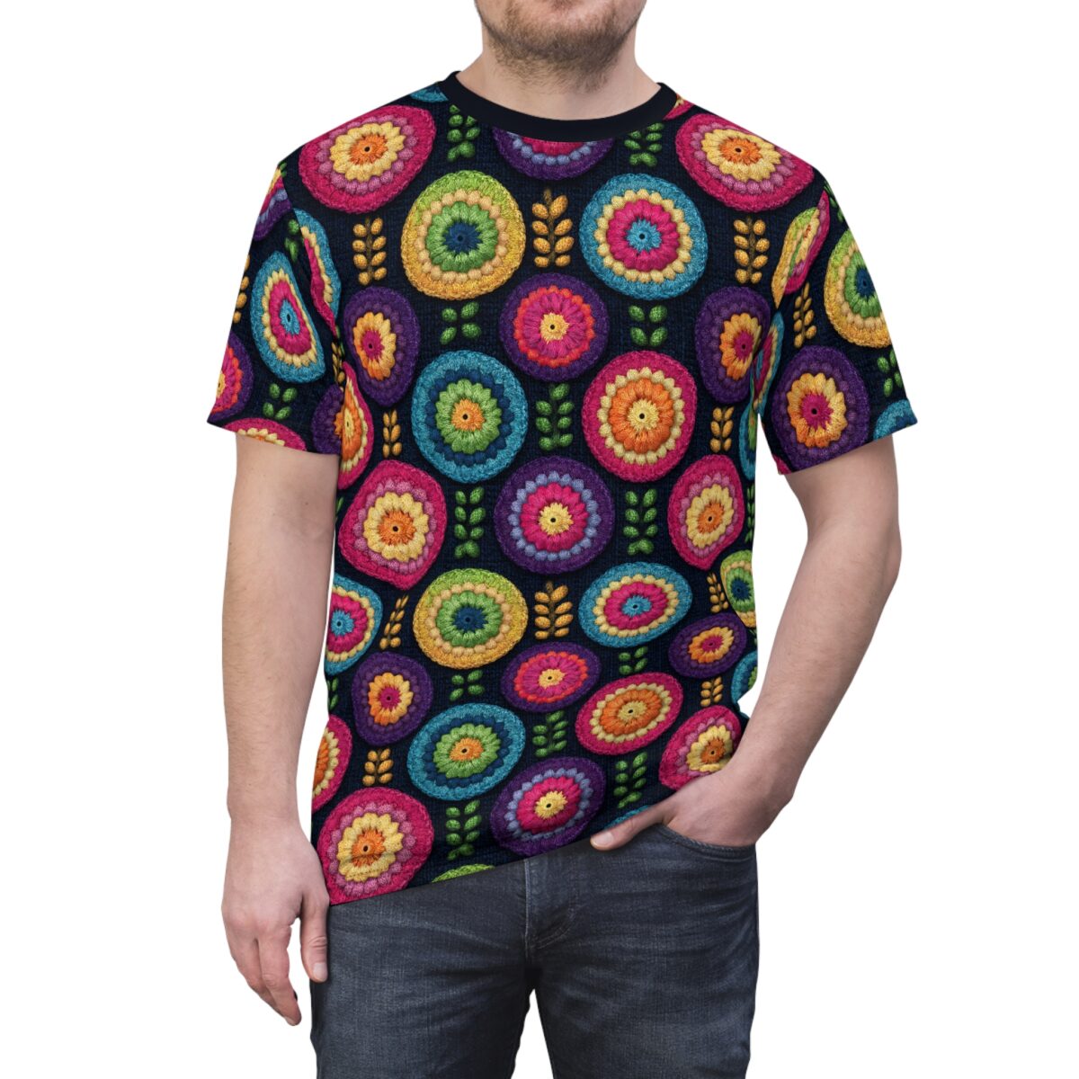 Men's sublimation tee with all over print of colorful crochet flowers and small leaf motifs on a dark background.