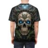 Cyber grunge all over print t-shirt featuring a detailed skull with glowing blue eyes and intricate metallic headpiece, surrounded by dark foliage.