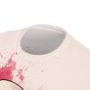 Pink watercolor splash graphic t-shirt featuring abstract paint splatter design.