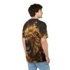 Man wearing a black t-shirt with a large, detailed graphic of a roaring golden lion with paint splatter effects.