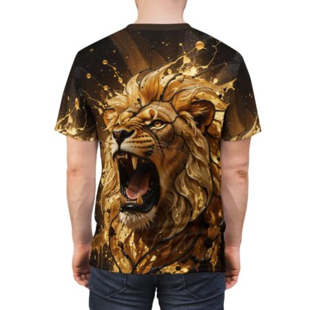 Back view of a man wearing a t-shirt featuring a large, gold, roaring lion head graphic with black ink splashes.