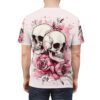 All over print sublimation tee featuring a detailed graphic of two skulls entwined with pink roses and watercolor splatters.