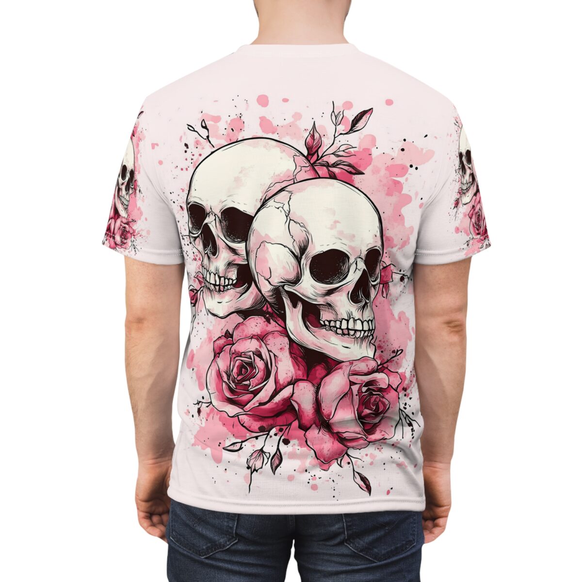 All over print sublimation tee featuring a detailed graphic of two skulls entwined with pink roses and watercolor splatters.