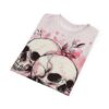 Pink watercolor graphic tee with two skulls and floral accents, featuring a grunge aesthetic and soft aesthetic design.