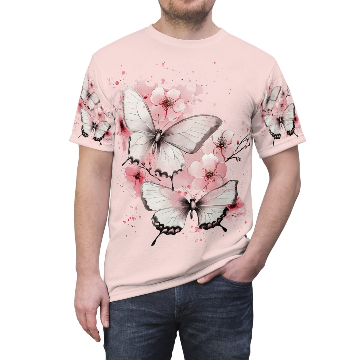 White butterflies and pink cherry blossoms wrap around sublimation tee with a pink watercolor splash background.