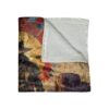 Abstract cowboy silhouette with geometric shapes and splatters of red and blue on a vintage-style blanket.