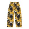 Yellow pajama pants featuring a repeating badger and floral pattern with dark leaves and white flowers.
