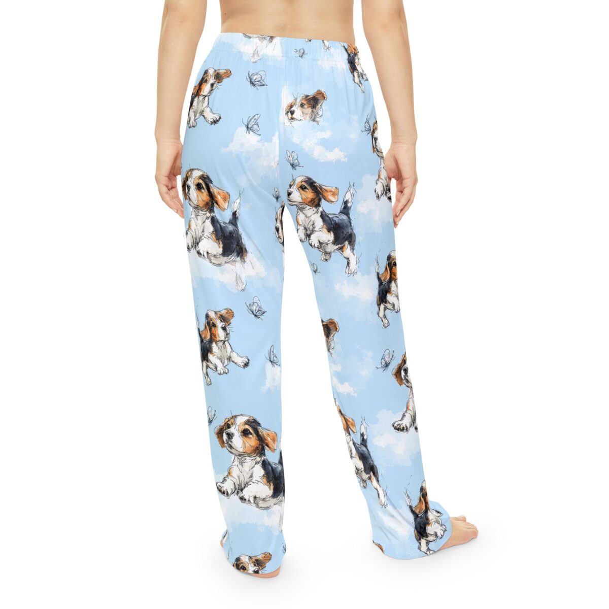 Light blue pajama pants with an all over print of beagle puppies and butterflies on clouds. Seamless print.