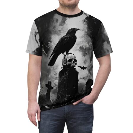 Black sublimation tee features a gothic scene with a raven perched on a skull atop a tombstone, with bats and crosses in the background.