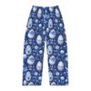 Blue pajama pants with an all over print of decorative Easter eggs and floral elements in a Chinoiserie style.