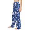 Blue and white all over print pajama pants featuring floral and decorative egg motifs.