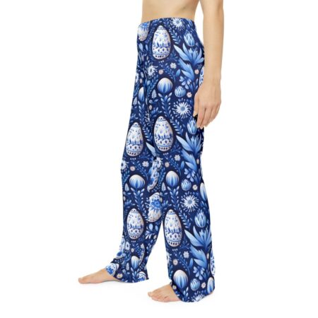 Blue and white all over print pajama pants featuring floral and decorative egg motifs.