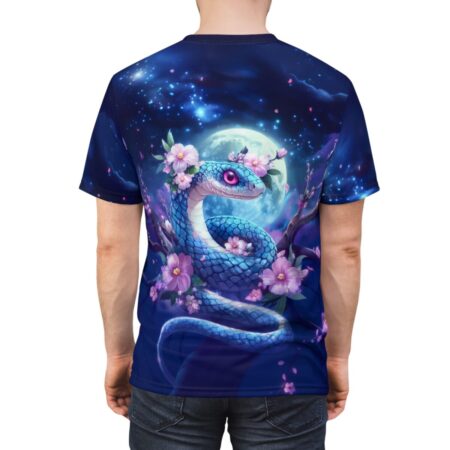 Vibrant blue snake entwined with pink flowers, set against a full moon and starry night sky on an all-over print t-shirt.