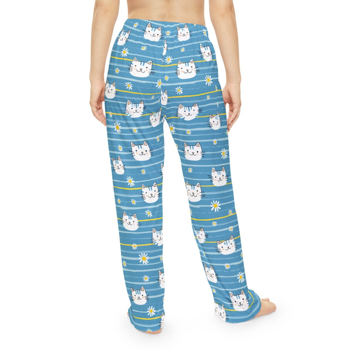 Blue striped pajama pants featuring an all-over print of cute cat faces and white daisies with yellow centers.