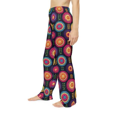 Boho floral print pajama pants featuring vibrant, embroidered-style circles and leaves on a dark background. Seamless all over print design.