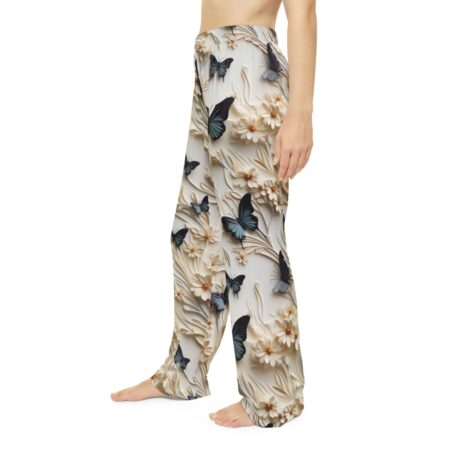 White pajama pants featuring a seamless all over print of blue butterflies and detailed white floral designs.