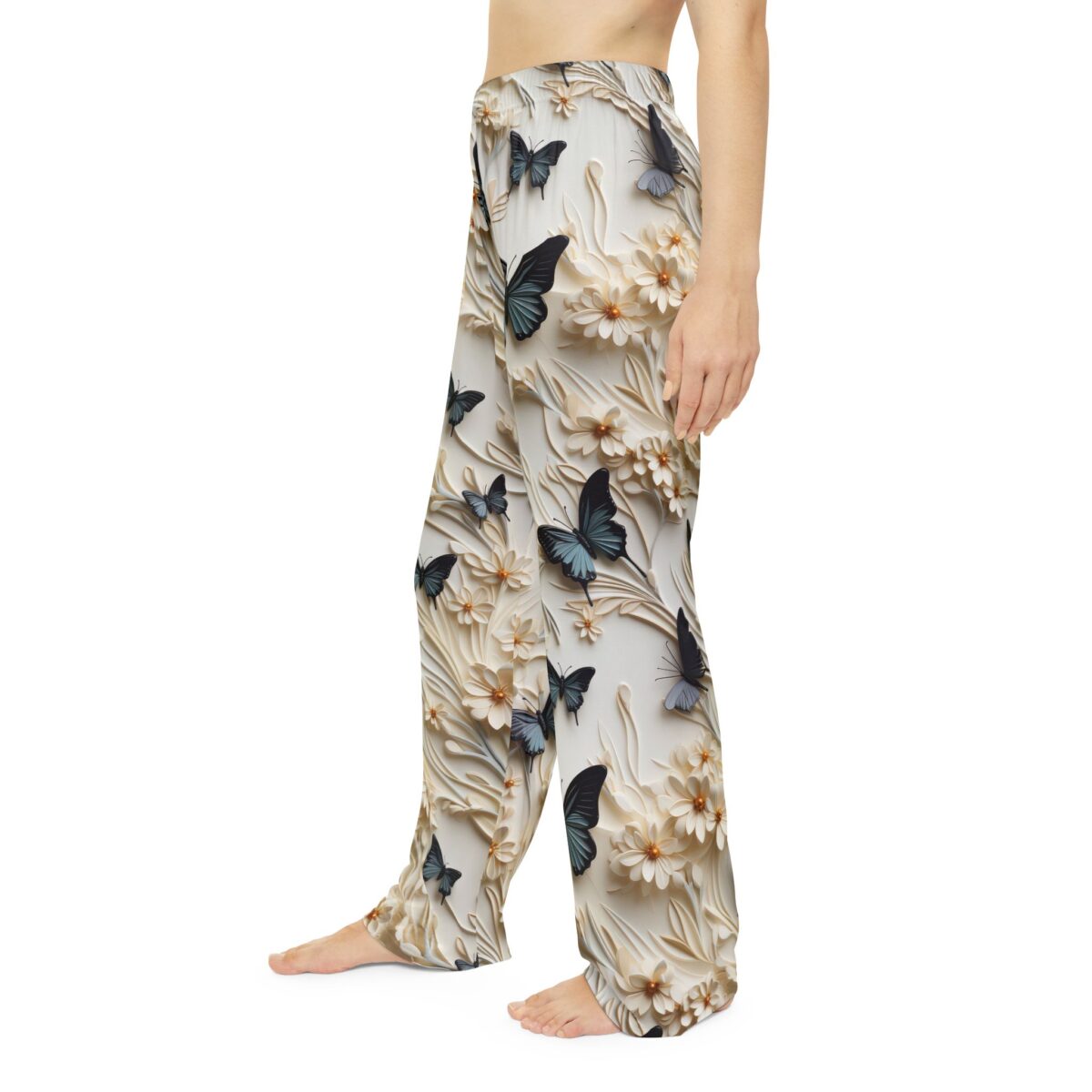 White pajama pants featuring a seamless all over print of blue butterflies and detailed white floral designs.