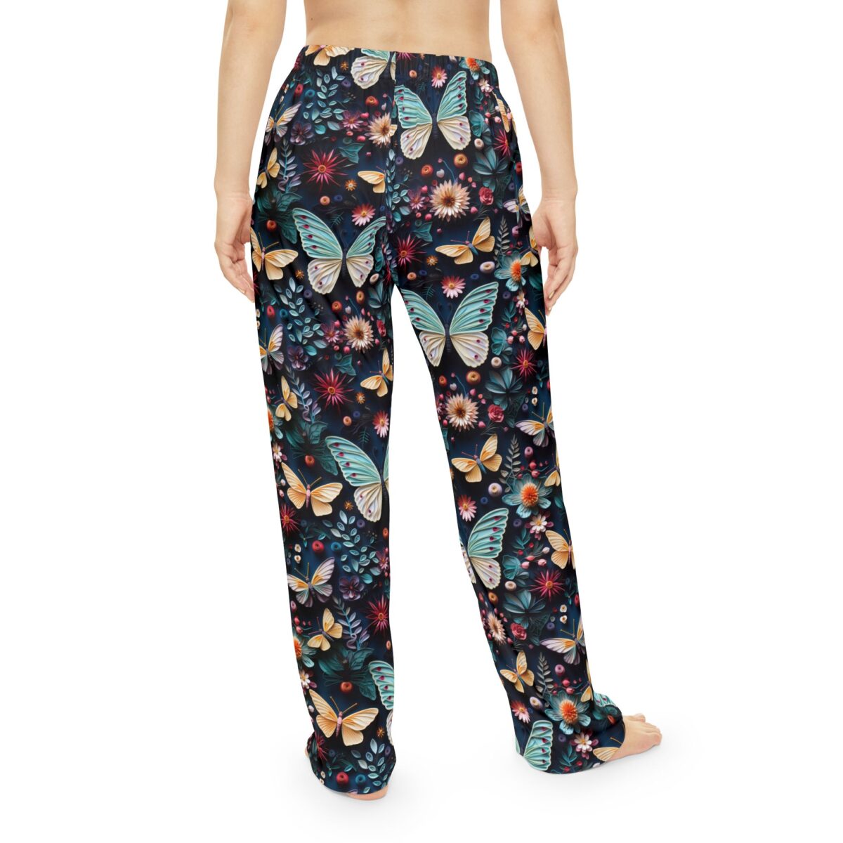 Dark floral and butterfly print pajama pants with a seamless wrap around graphic design.