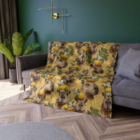 Cozy throw blanket featuring a seamless pattern of capybaras wearing lemon wreaths and surrounded by citrus slices and flowers on a gold textured background.