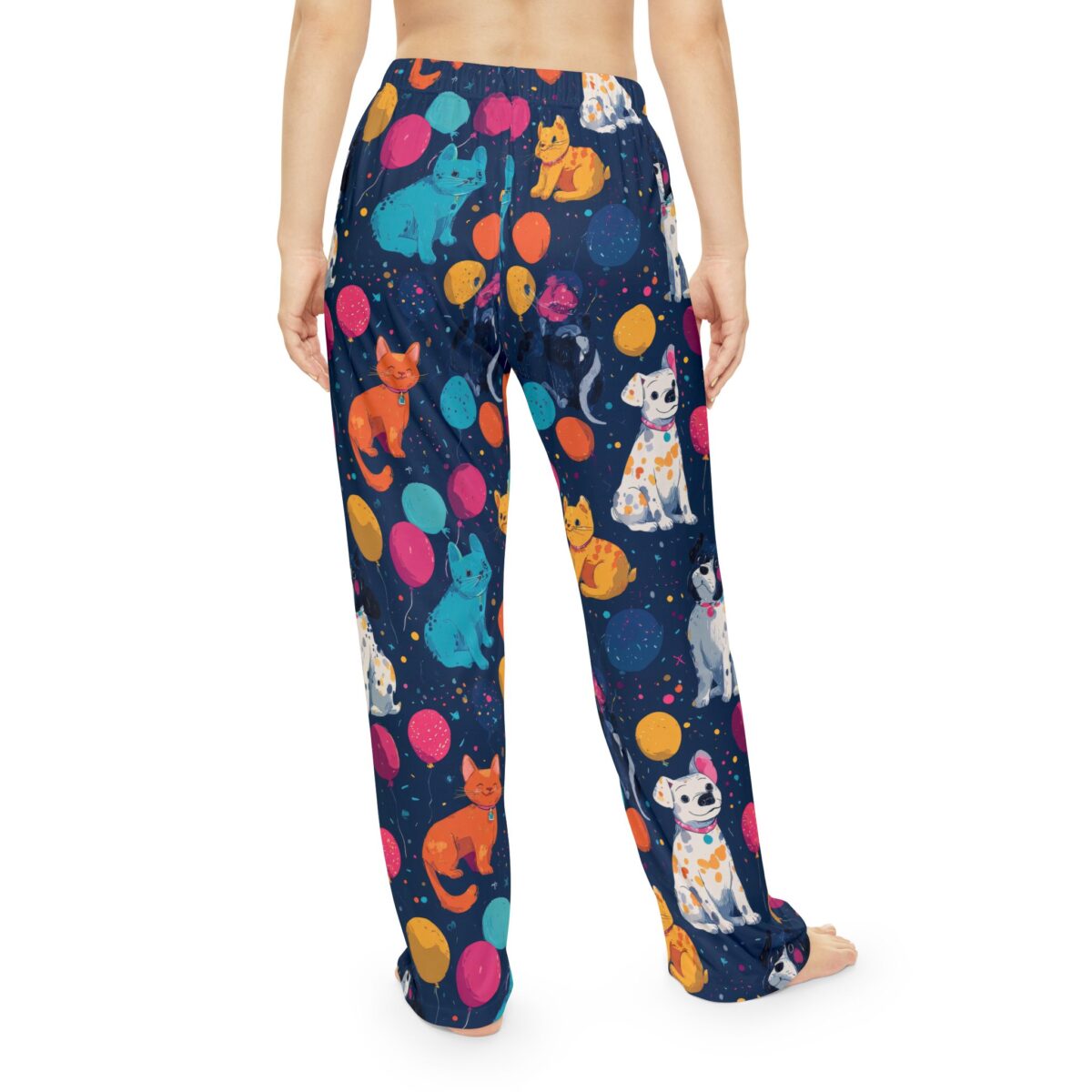 Navy blue pajama pants with a seamless all over print of cartoon cats, dogs, and balloons.