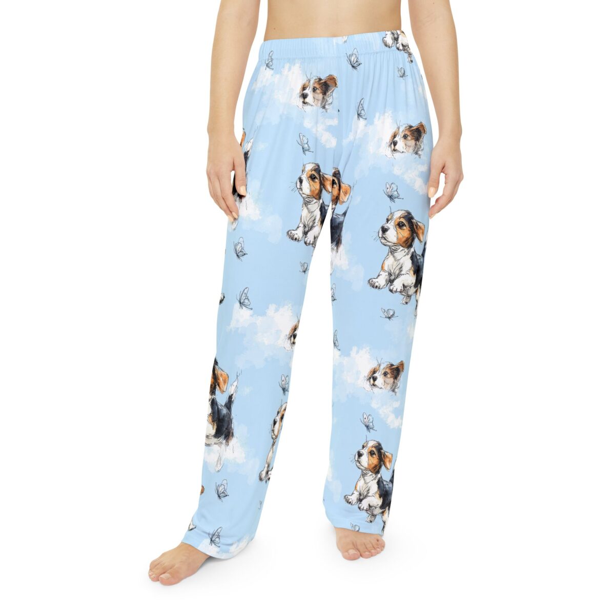 Light blue pajama pants feature a seamless print of cute beagle puppies and butterflies floating among white clouds.