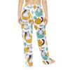 Cute illustrated cats in various poses on white sublimation pajama pants with abstract yellow and teal circle graphics.