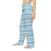 Light blue striped pajama pants with cute cartoon cats and white daisies scattered throughout the seamless print.