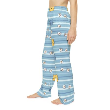 Light blue striped pajama pants with cute cartoon cats and white daisies scattered throughout the seamless print.
